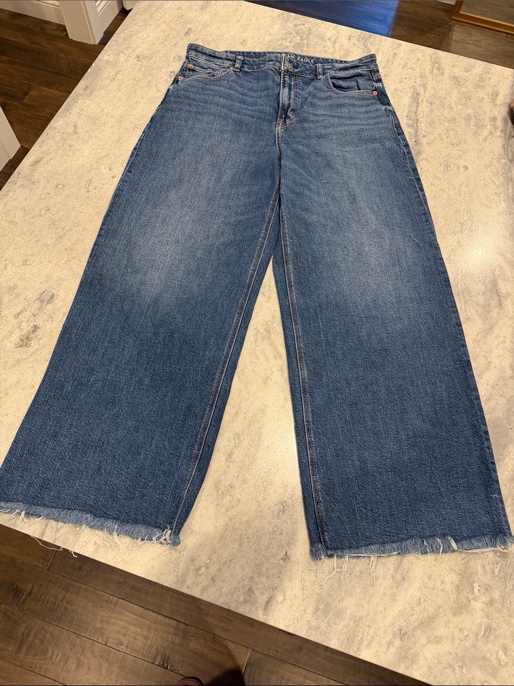 American Eagle Outfitters Wide-Leg Raw Hem Jeans in Medium Blue